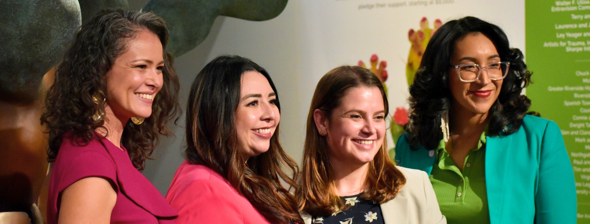 Four women smiling for a picture