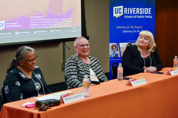 Three women at a panel table