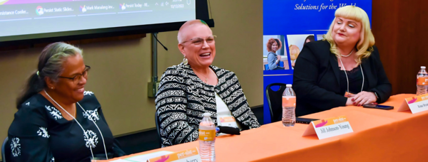 Three women at a panel table